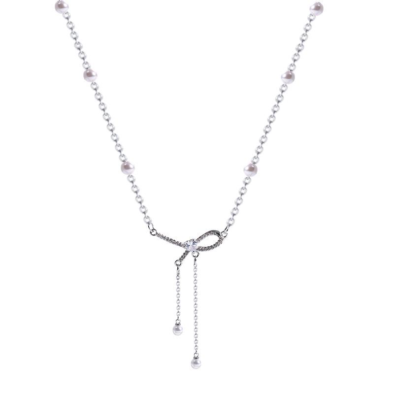 Elegant Bow & Pearl Tassel Titanium Necklace