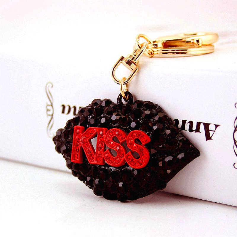 Elegant Diamond-Studded Four-Leaf Clover Keychain: Perfume Bottle Bag Charm for Women