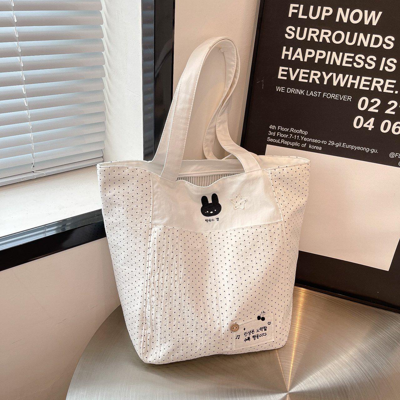 

Trendy Cartoon Canvas Tote Bag: Cute Student Handbag with Casual Style and Design Sense