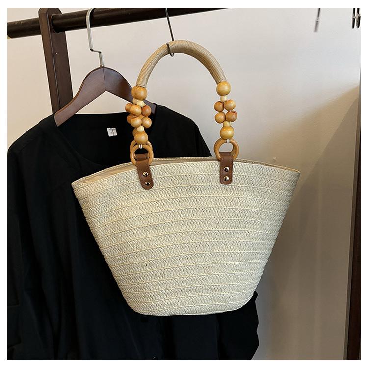 Design sense woven large-capacity handbag women's beach vacation style versatile solid color casual personality shoulder bag