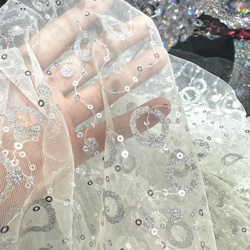 Embroidered sequin round patchwork net fabric suitable for wedding dresses formal gowns and designer clothing fabrics