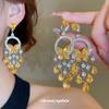 Silver Needle Diamond Inlaid Butterfly Tassel Earrings and Necklace Set: Elegant Hollow Design with Personality and Style.