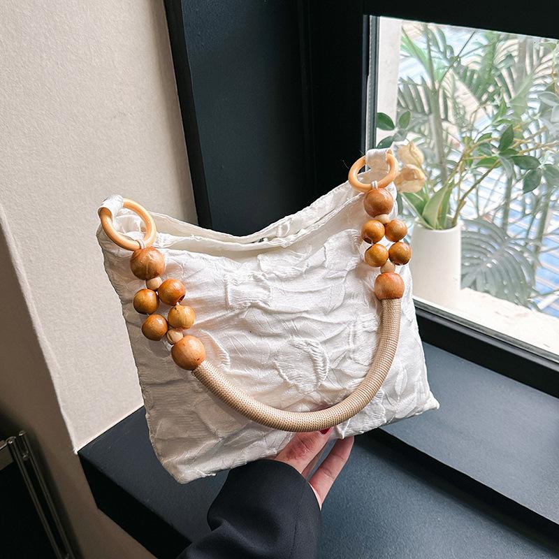 

Маленькая женская сумка 2024 лето новая ретро плетеная цепочка на плечо сумка-подмышка корейская версия модная портативная маленькая квадратная сумка белый