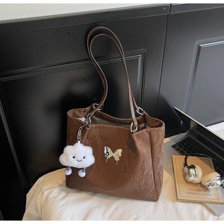 

Design sense niche commute to work shoulder bag women 2025 new retro large capacity Korean version tote big bag women темно-коричневого