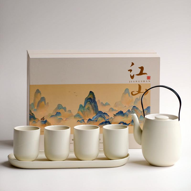 

Guirong Creamy Ceramic Teapot Set with 4 Cups and Tray - Home or Business Use Souvenir