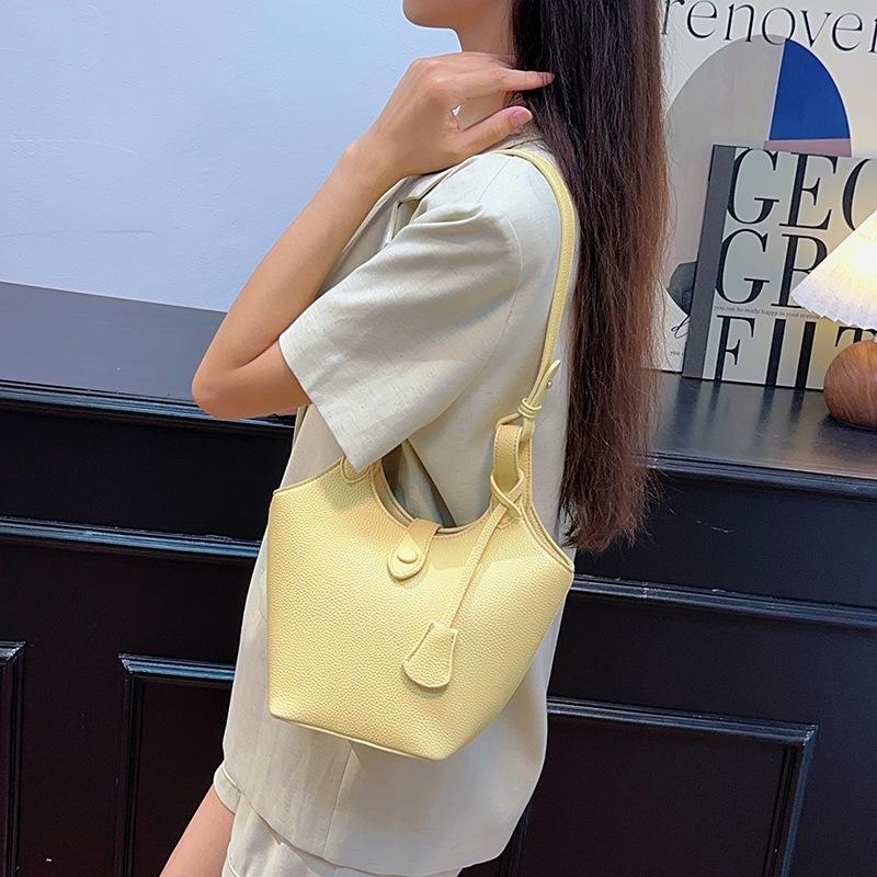 Koreanische Version Tragbare Gemüsekorb-Tasche mit Litschi-Muster Damen 2025 neue trendige Mode Bucket Bag vielseitige Ins Umhängetasche