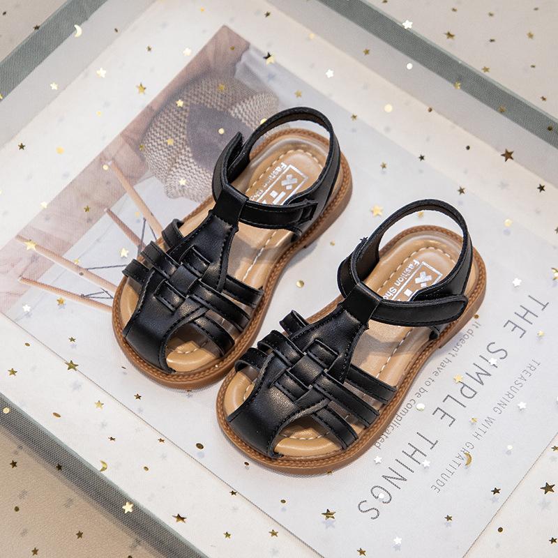 Flickors flätade sandaler 2025 sommar nya babyflickors romerska sandaler mjukbottnade prinsesskor barns strandskor trend