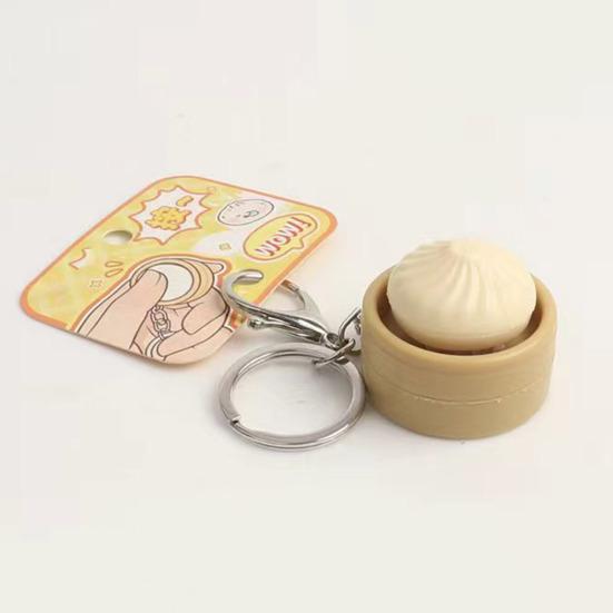 Gedämpfte Brötchen Schlüsselanhänger Quetschspielzeug mit Geräusch Niedlicher PVC Fidget zur Stressbewältigung Tragbares Dekompressions-Gadget für Kinder Erwachsene