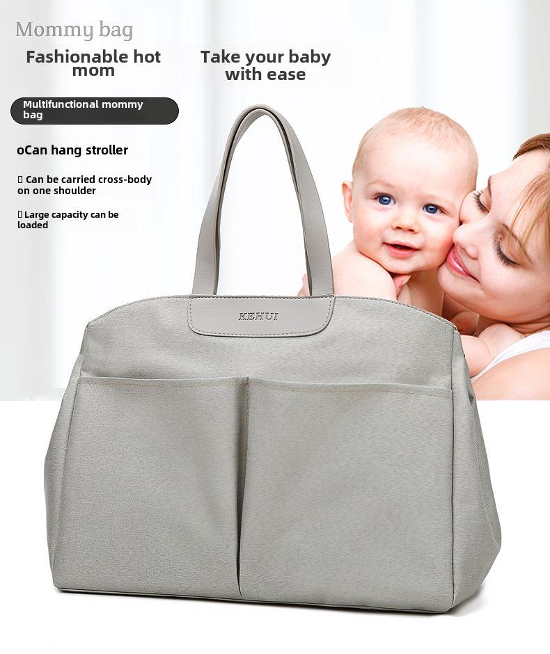 Modische multifunktionale Mamatasche: Isolierte Wickeltasche zum Tragen in der Hand, als Schultertasche oder als Messenger-Tasche für Mutter und Baby