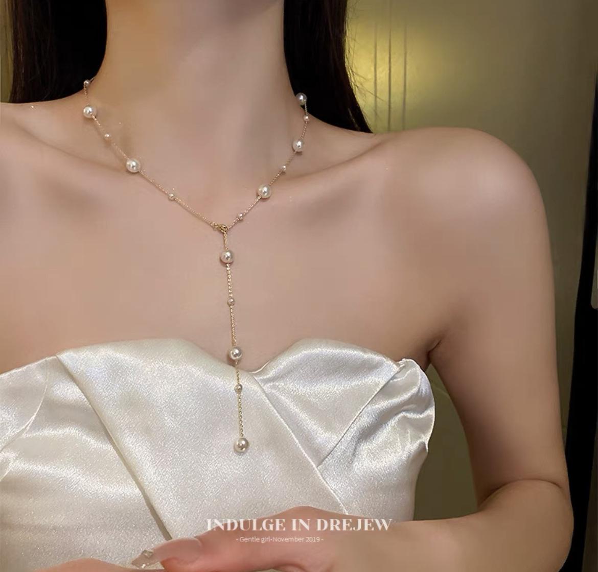 

Элегантное жемчужное ожерелье-бантик: Роскошная цепочка на ключицу из сплава с нишевым дизайном