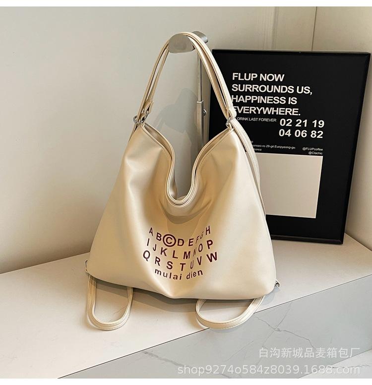 

Letter large capacity double shoulder bag women s 2025 new trendy Korean niche tote bag casual shoulder commuter bag бежевый
