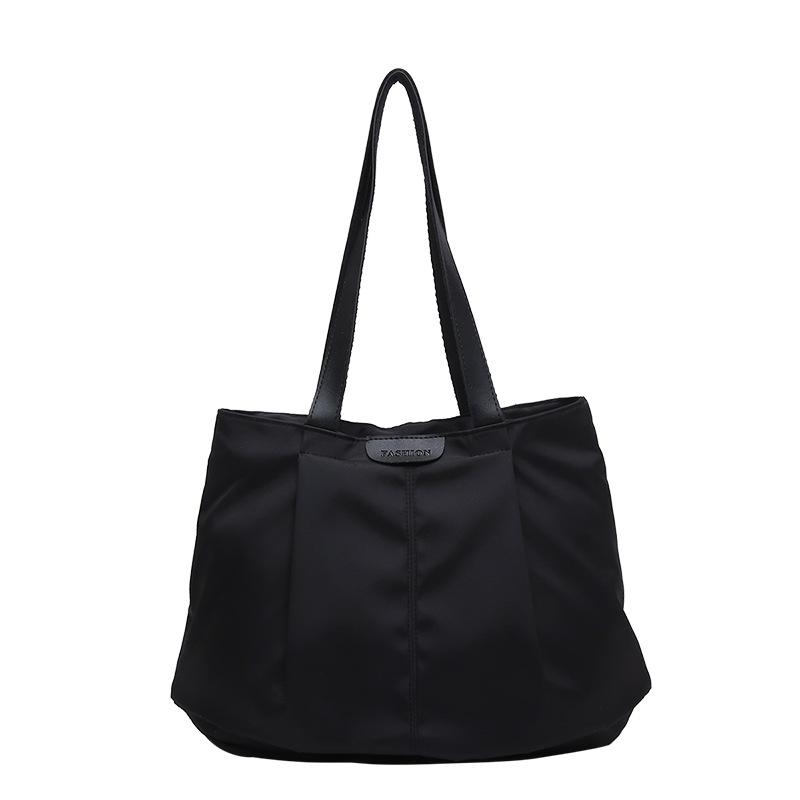 Large-capacity women's bags, new fashionable waterproof bags, portable shoulder large bags, casual and simple cloth bags.