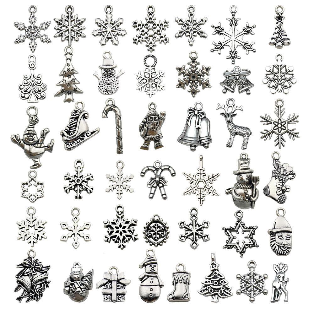 100-teiliges Weihnachts-Tropföl-Legierungs-Schmuckzubehör: Weihnachtsmann, Schneemann, Glocke, Rentier Anhänger für DIY Armbänder.