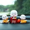 Creative Little Monk Maitreya Buddha Car Ornament: Cute, Shaking Head Resin Doll for Car Interior Decoration and Safety.
