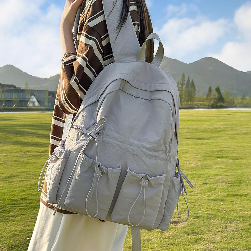 Large capacity schoolbag female junior high school student cute bow high school large backpack female student high value college backpack
