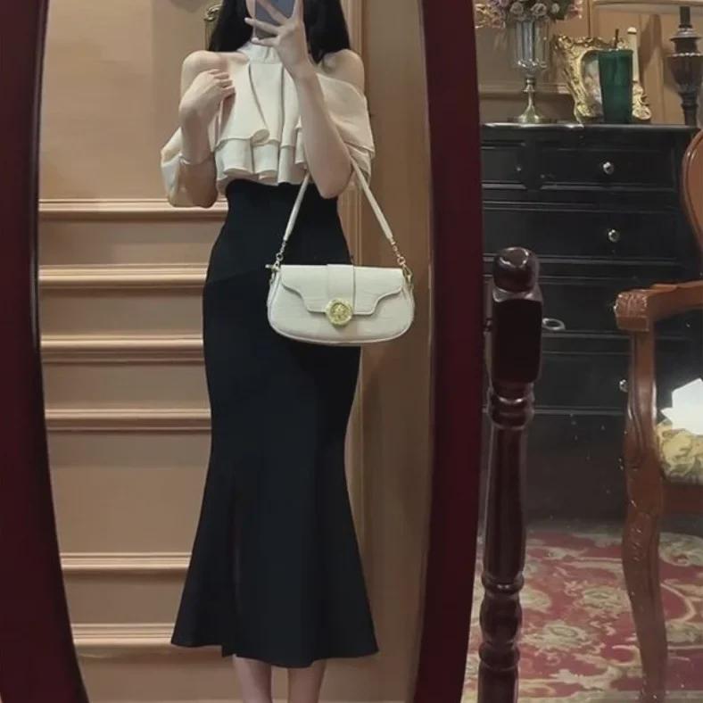 

Комплект из двух предметов в корейском стиле осень 2025: Юбка и топ средней длины с драпировкой M