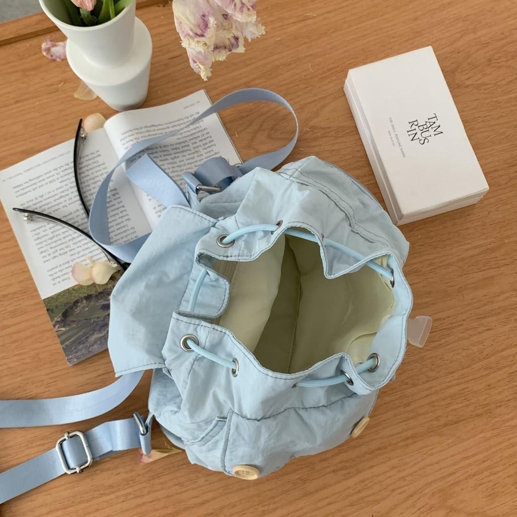 IELGY new Korean niche design outdoor pocket button drawstring double shoulder nylon backpack