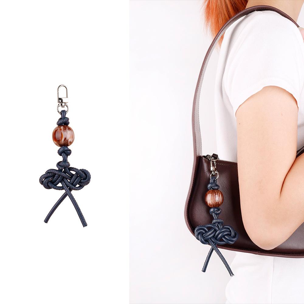 MIU series creative color hand-woven ruyi knot pu leather cord accessories bag pendant keychain