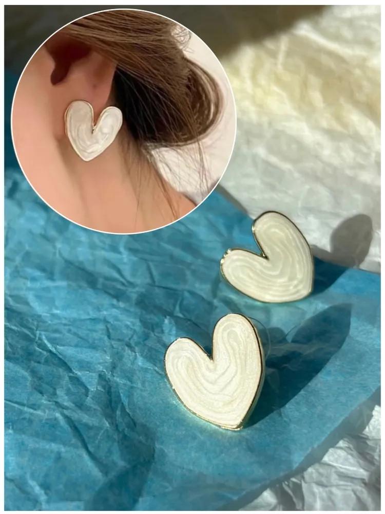 

Серьги-сердечки из циркония белый