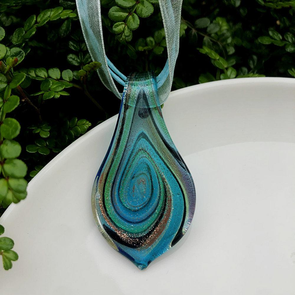 Trendy Blue Glass Ribbon Pendant Necklace & Earring Set - Perfect Seaside Vacation Accessory.