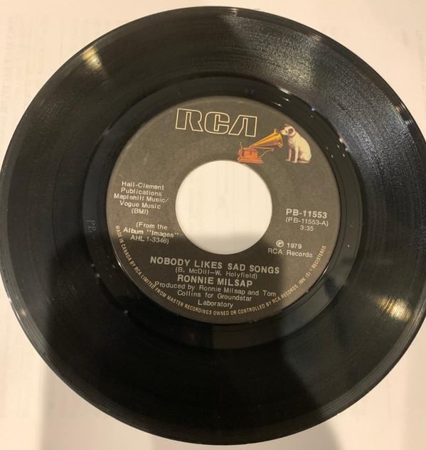 

7inch Record RONNIE MILSAP Nobody Likes Sad Songs PB11553 RCA 1979 Canada CountryFolk Used