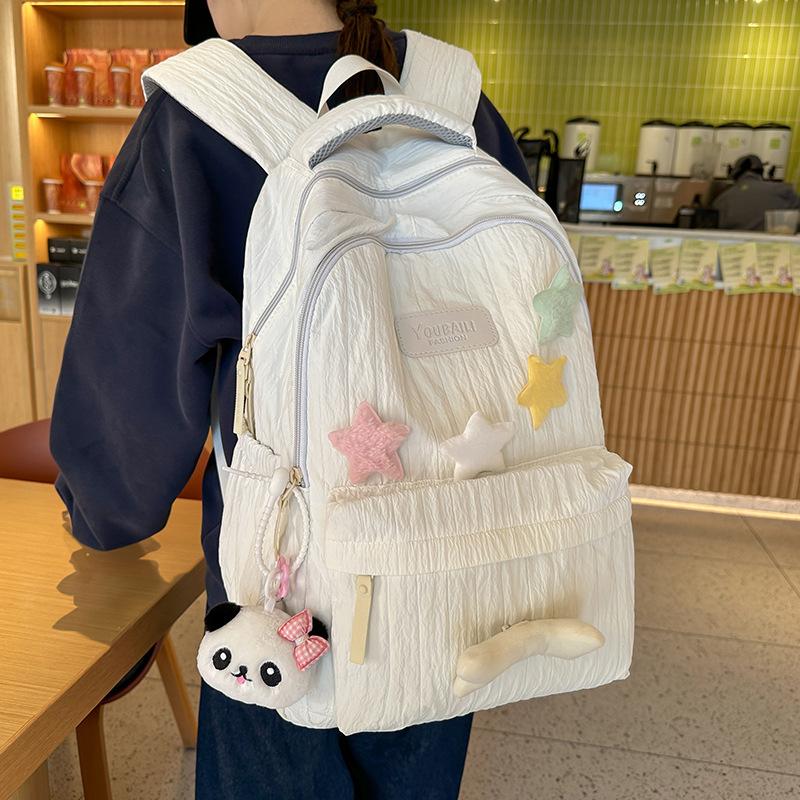 Schoolbag Korean version of high-value star backpack schoolbag large capacity lightweight girl cute versatile junior high school student backpack