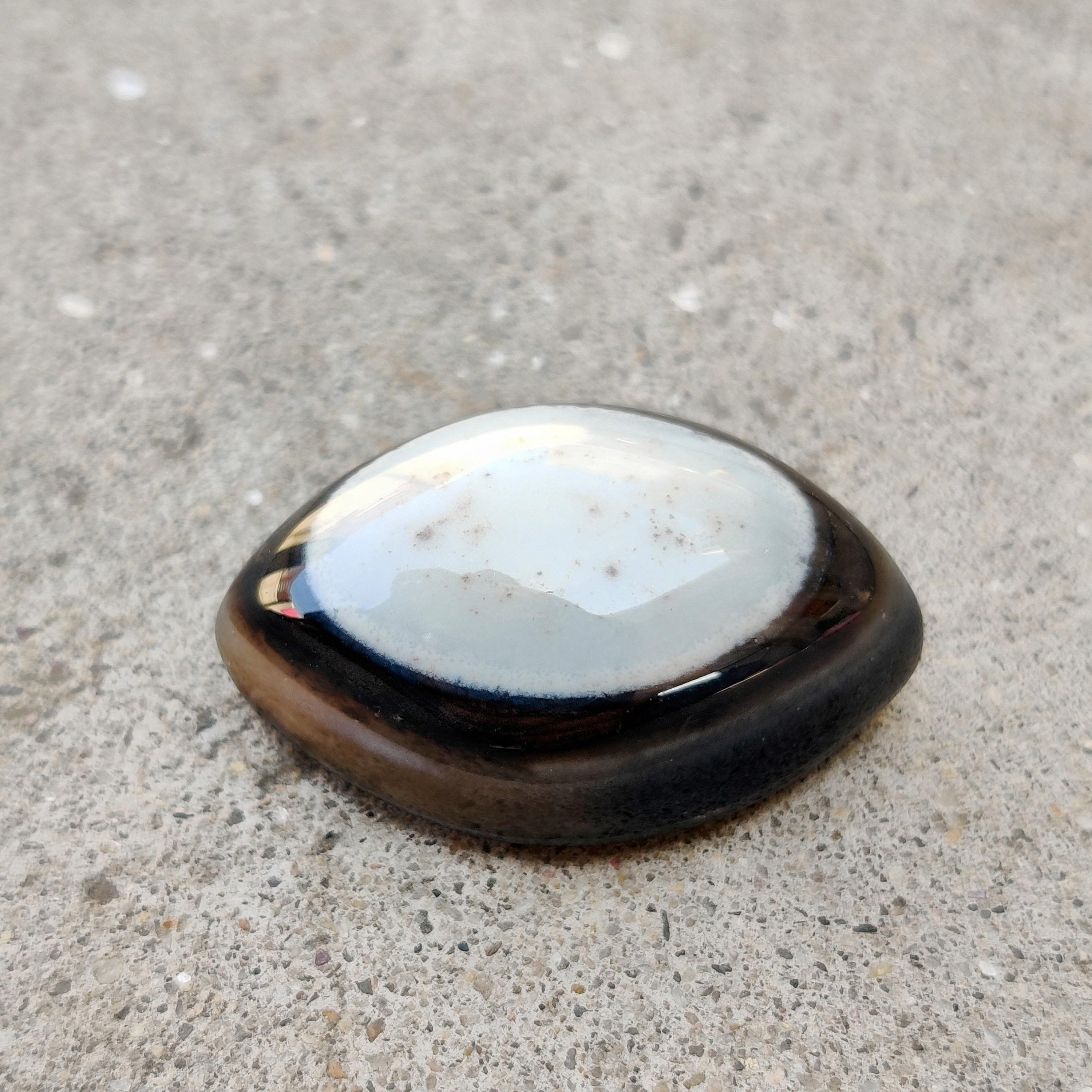 

Loose Black Banded Eye Cabochon Gemstone, 41.50 Carat, 28x19x12 MM Size. 41.50 Carat, 28x19x12 MM