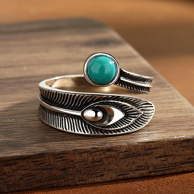 Vintage turquoise feather ring with adjustable opening.