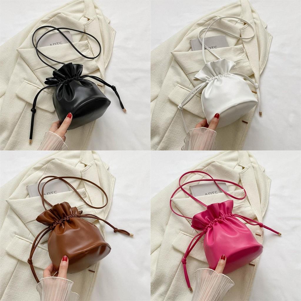 Fashionable Simple Bucket Bag For Women With Soft Structure Available In Black White Brown And Fuchsia