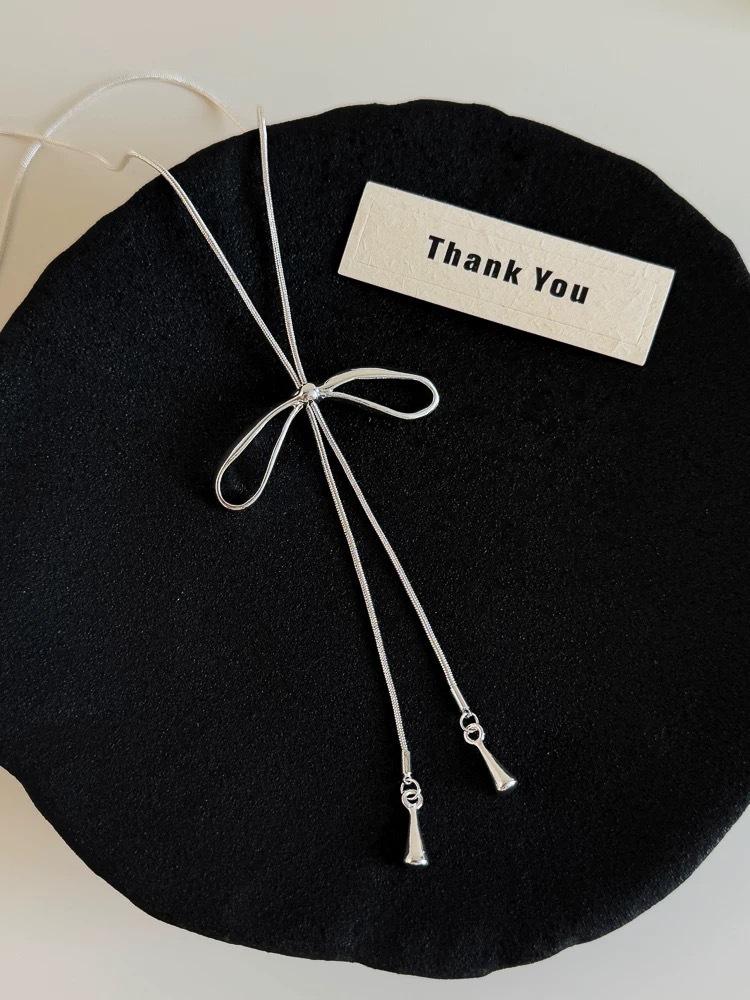 

Bow necklace women s Korean long decorative snake bone chain light luxury niche daily versatile summer accessories wear