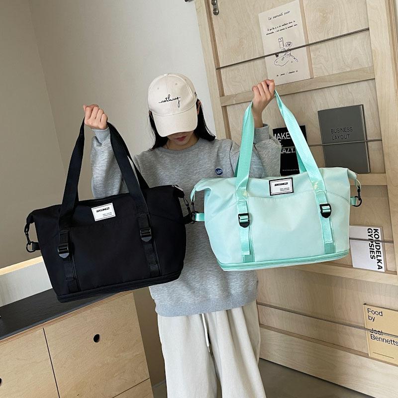 Short-haul travel bags, men's and women's large-capacity sports fitness bags, handbags, waterproof storage, large bags, portable macarons.