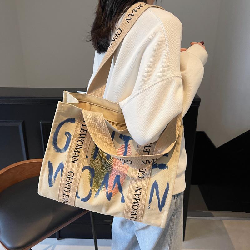 Commuter large-capacity alphabet canvas bag women's new fashion college student shoulder tote bag portable leisure bag