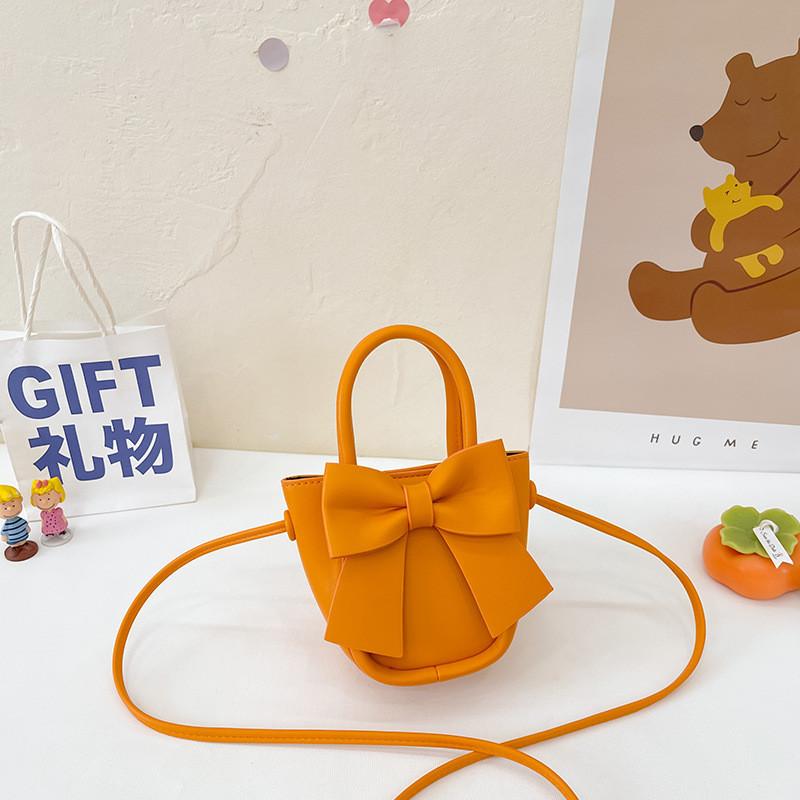 

Trendy Miniature Children s Handbag With Chic Bow Detailing And Spacious Coin Compartment