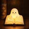 Ghost Figurine Desk Lamp Magic Book Night Light, Resin Tabletop Warm Glow with Moon Soft Yellow Light Star Relief, Cute Bedside Sleeping for