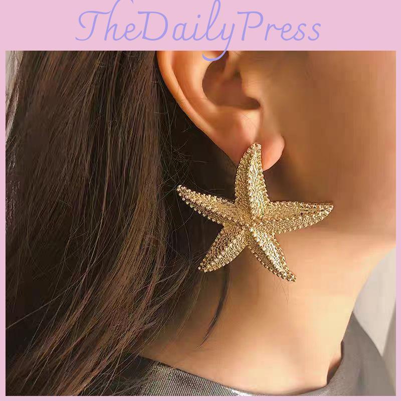 Elegante goldene Seestern-Ohrringe Stilvoller legierter Überzug Sommerschmuck für Damen