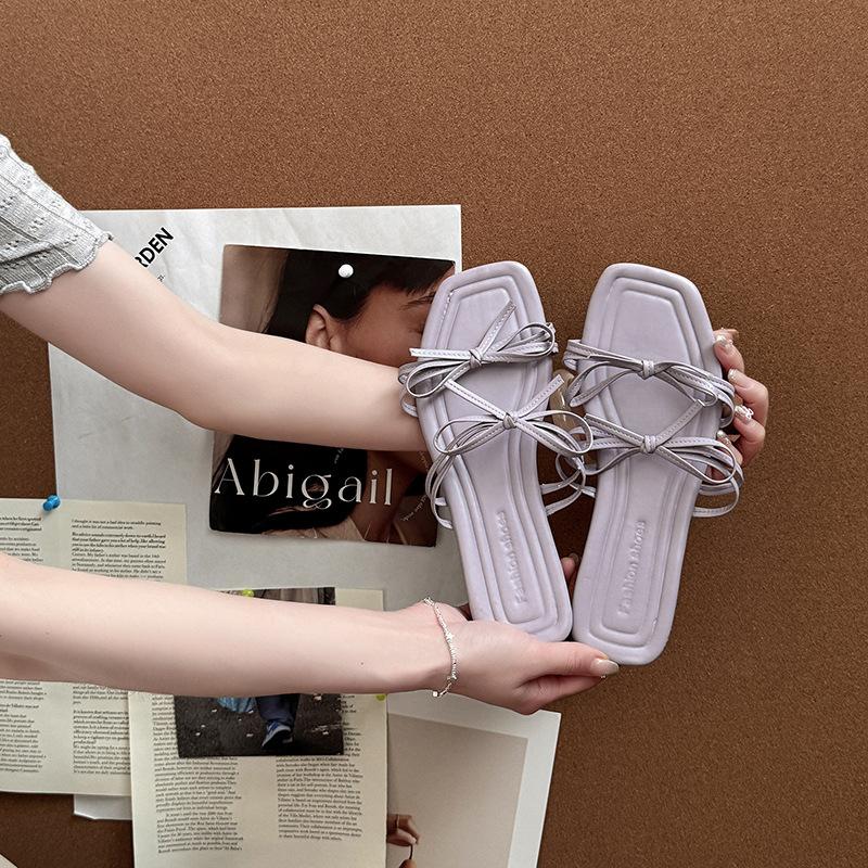 Stylish and simple versatile strap bow with open-toed cool slippers women's 2025 summer new flat-bottomed slippers
