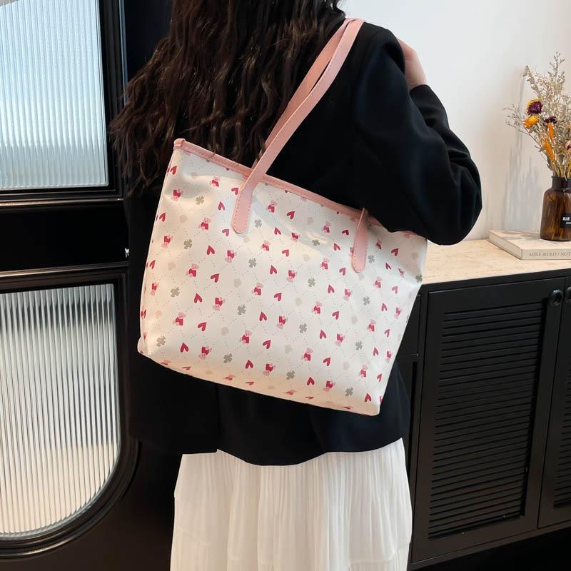 The new beautiful and fresh summer popular versatile large-capacity students commute to class versatile portable shoulder armpit bag