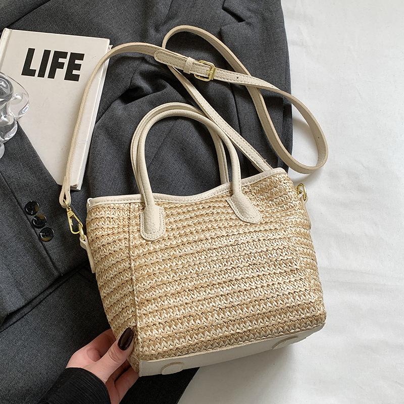 2025 New Niche Design Contrasting Colors Straw Hand-held Bucket Bag Leisure Commuting Vacation Wind Messenger Beach Bag Women