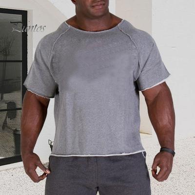 Camiseta de gimnasio de verano para hombre, jersey de manga corta con cuello redondo de Color sólido, Top deportivo de retales con absorción de sudor de longitud media para correr