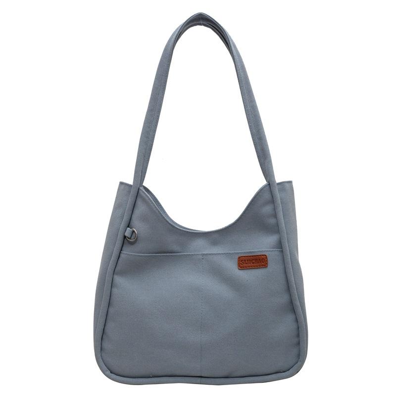 Simple niche canvas bag, new large-capacity women's retro shoulder bag, textured commuter shoulder underarm bag for women