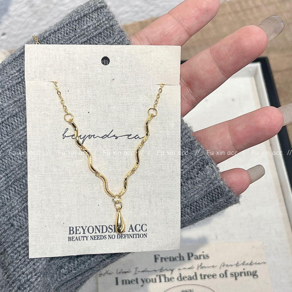 Retro Wavy Water Drop Necklace: Euro-American Style, Neutral, Gold & Silver Sweater Chain.