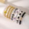 Korean version of fashion new multi-layer elastic thread soft pottery love smiley face bracelet set retro handmade pearl jewelry women