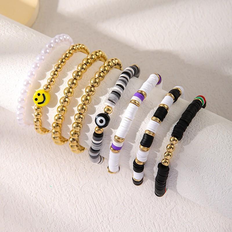 Korean version of fashion new multi-layer elastic thread soft pottery love smiley face bracelet set retro handmade pearl jewelry women