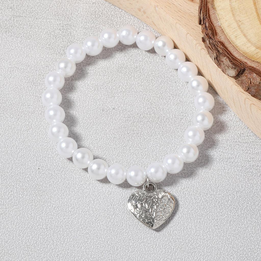 Korean version of simple fashion temperament elegant imitation pearl silver love heart pendant necklace bracelet set versatile