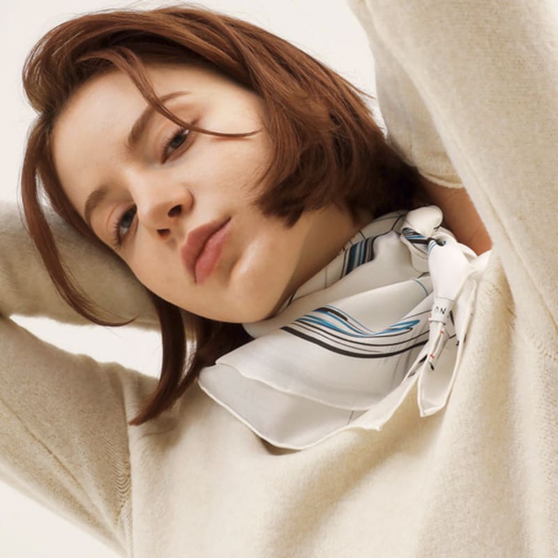 Woman wearing ONSZ hat and silk scarf