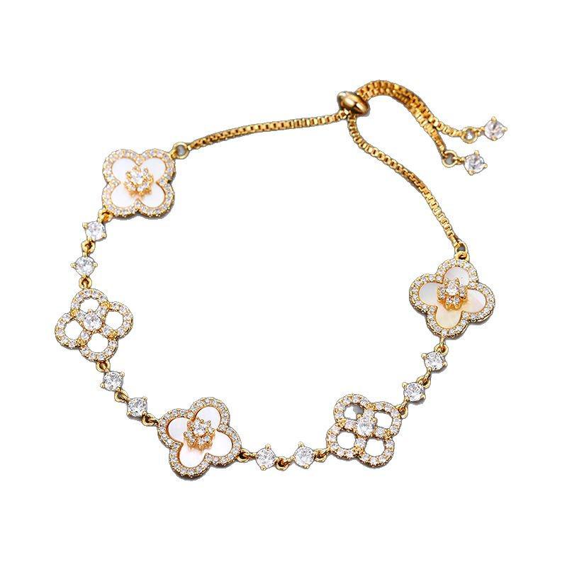 Náramek se čtyřlístkem z imitace perleti a diamantů - Dutý a třpytivý design se stahovací šňůrkou, Lehký luxusní módní ruční šperk.
