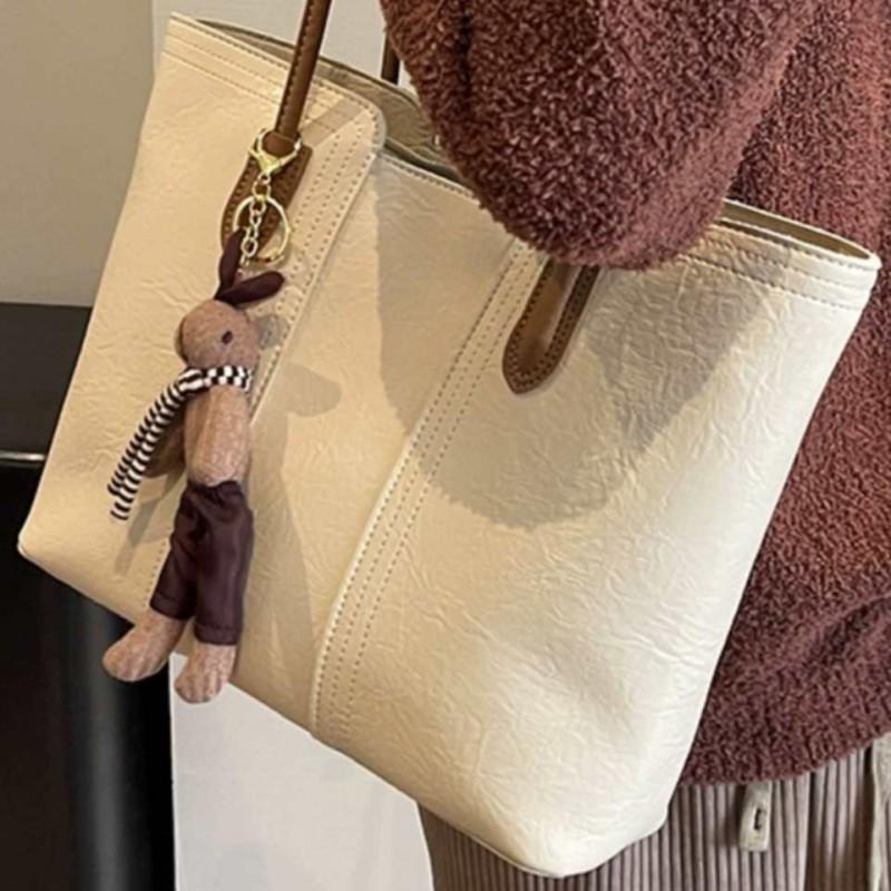 Hochwertige Retro-Tasche mit großem Fassungsvermögen, modische Damen-Umhängetasche für Pendler, beliebte Tragetasche