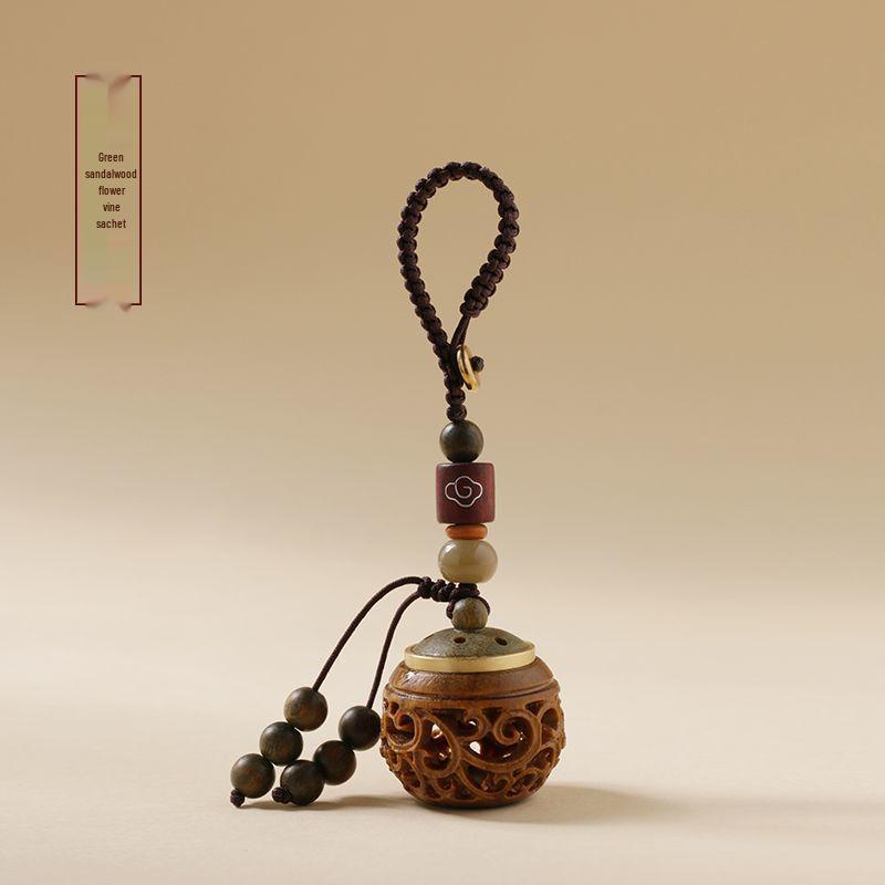Green Sandalwood Hollow Mobile Phone Chain: Exquisite Aromatherapy Sachet Ball and Tibetan Incense Pendant Keychain in Ancient Style.