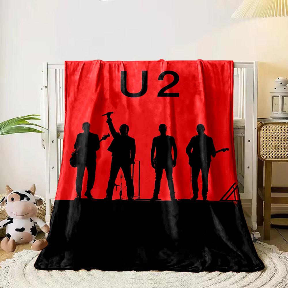 

Bold red background with black silhouettes of four musicians performing. for all seasons blanket lunch break throw gift 80cm x 120cm
