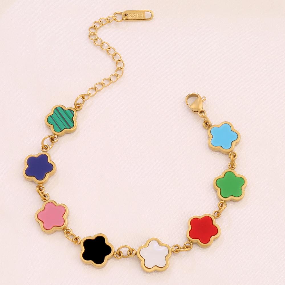 

Браслет из нержавеющей стали с цветком-четырёхлистным клевером и лепестками из ракушек